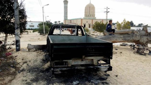 A burned truck is seen outside Al-Rawda Mosque in Bir al-Abd northern Sinai, Egypt a day after attackers killed hundreds of worshippers, on Saturday, Nov. 25, 2017. (AP Photo) A burned truck is seen outside Al-Rawda Mosque in Bir al-Abd northern Sinai, Egypt a day after attackers killed hundreds of worshippers, on Saturday, Nov. 25, 2017. (AP Photo)