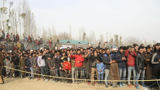 As Dhoni stepped into Kunzer cricket ground, in north Kashmir’s Baramulla district, frenzied fans jostled with each other to catch a glimpse of him. (Waseem Andrabi / HT Photo) As Dhoni stepped into Kunzer cricket ground, in north Kashmir’s Baramulla district, frenzied fans jostled with each other to catch a glimpse of him. (Waseem Andrabi / HT Photo)