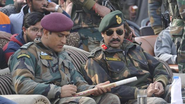 MS Dhoni signs a cricket bat during a match in Kunzer, 35 km from Srinagar. (Waseem Andrabi / HT Photo) MS Dhoni signs a cricket bat during a match in Kunzer, 35 km from Srinagar. (Waseem Andrabi / HT Photo)