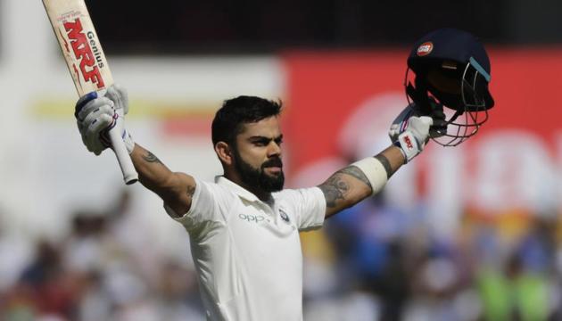 Virat Kohli celebrates after scoring a century on Day 3 of the second Test match between India and Sri Lanka at the Vidarbha Cricket Association Stadium in Nagpur.(AP)