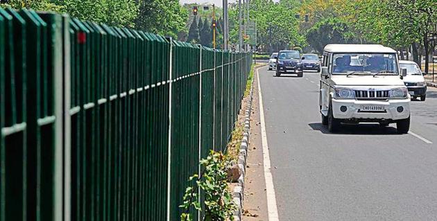 Railings installed on a median on Madhya Marg in Chandigarh. Even as the UT architect department objected to the move and stated that the height should not be more than 3 feet, the engineering department went on to install 5-foot-high railings in April this year. (HT File) Railings installed on a median on Madhya Marg in Chandigarh. Even as the UT architect department objected to the move and stated that the height should not be more than 3 feet, the engineering department went on to install 5-foot-high railings in April this year. (HT File)