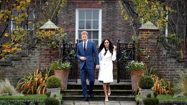 Britain's Prince Harry walks out with Meghan Markle during their first appearance after the announcement of their engagement was made at Kensington Palace on November 27, 2017 in London, Britain. (Toby Melville / REUTERS)
