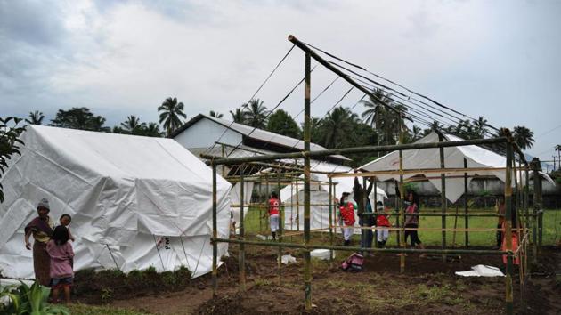 People prepared makeshift evacuation centres in the Rendang sub-district of Karangasem Regency as fears of a larger scale eruption grew over the weekend. Indonesia sits on the ‘Pacific Ring of Fire’ and has more than 120 active volcanoes. Mount Agung’s last major eruption in 1963 killed about 1,100 people. (Sonny Tumbelaka / AFP) People prepared makeshift evacuation centres in the Rendang sub-district of Karangasem Regency as fears of a larger scale eruption grew over the weekend. Indonesia sits on the ‘Pacific Ring of Fire’ and has more than 120 active volcanoes. Mount Agung’s last major eruption in 1963 killed about 1,100 people. (Sonny Tumbelaka / AFP)