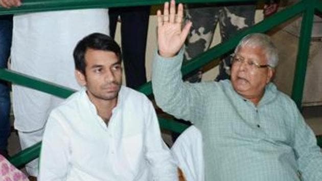 RJD’s Tej Pratap with his father Lalu Prasad.(PTI file)