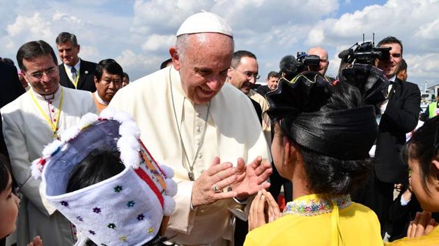 Pope Francis is greeted by children upon his arrival at Yangon International Airport on November 27. (AFP Photo) Pope Francis is greeted by children upon his arrival at Yangon International Airport on November 27. (AFP Photo)
