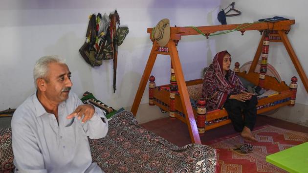 Dharejo rocked gently on a swing bed next to her husband Zulfiqar (L) in her sparse drawing room, recalling how he begged her to stand down but she refused, facing down armed relatives who had long sought to usurp her family’s property. A five-year legal battle eventually saw her foes pay half a million rupees ($4,800) in compensation and offer a public apology -- an act of utmost disgrace in rural Pakistan. (Asif Hassan / AFP) Dharejo rocked gently on a swing bed next to her husband Zulfiqar (L) in her sparse drawing room, recalling how he begged her to stand down but she refused, facing down armed relatives who had long sought to usurp her family’s property. A five-year legal battle eventually saw her foes pay half a million rupees ($4,800) in compensation and offer a public apology -- an act of utmost disgrace in rural Pakistan. (Asif Hassan / AFP)