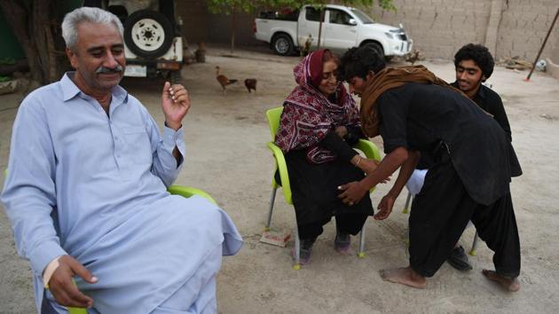 “She has become such a huge tree spreading soothing shade to the people around her,” commented Zulfiqar Dharejo as his wife, draped in a traditional Sindhi shawl met with workers. Born to a conservative feudal family she persuaded her father to allow her and her sisters to study, all the way to a degree in economics, defying rural Pakistani cultural norms of the time to educate daughters and teach them they were as good as boys. (Asif Hassan / AFP) “She has become such a huge tree spreading soothing shade to the people around her,” commented Zulfiqar Dharejo as his wife, draped in a traditional Sindhi shawl met with workers. Born to a conservative feudal family she persuaded her father to allow her and her sisters to study, all the way to a degree in economics, defying rural Pakistani cultural norms of the time to educate daughters and teach them they were as good as boys. (Asif Hassan / AFP)