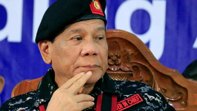 Philippine President Rodrigo Duterte, wearing a military uniform, gestures as he attends the 67th founding anniversary of the First Scout Ranger regiment in San Miguel town, Bulacan province, north of Manila, Philippines November 24, 2017. (REUTERS) Philippine President Rodrigo Duterte, wearing a military uniform, gestures as he attends the 67th founding anniversary of the First Scout Ranger regiment in San Miguel town, Bulacan province, north of Manila, Philippines November 24, 2017. (REUTERS)