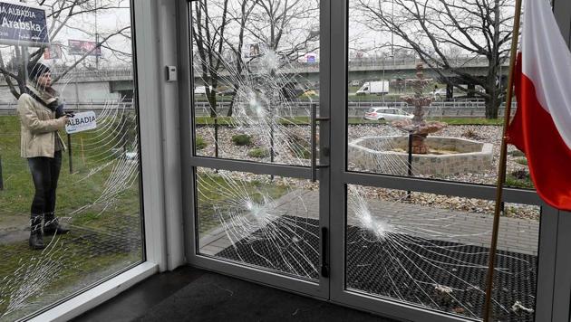 A policeman securing evidences is seen behind shattered glass of the Muslim Cultural Centre in Warsaw on November 27 after it was vandalised. (AFP Photo) A policeman securing evidences is seen behind shattered glass of the Muslim Cultural Centre in Warsaw on November 27 after it was vandalised. (AFP Photo)