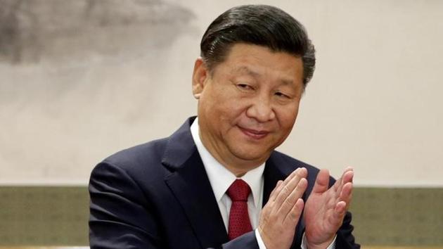 China's President Xi Jinping claps after his speech as he and other new Politburo Standing Committee members meet with the press at the Great Hall of the People in Beijing on October 25, 2017. (Reuters) China's President Xi Jinping claps after his speech as he and other new Politburo Standing Committee members meet with the press at the Great Hall of the People in Beijing on October 25, 2017. (Reuters)