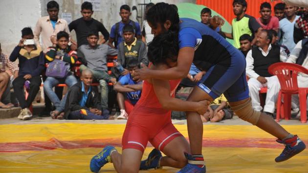 A total of 24 young women wrestlers (12 pairs) in the category of 48 kg and 75 kg are participating in the annual championship.(Rajesh Kumar / HT Photo)