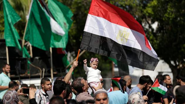 Palestinians waving the flags of Egypt and Palestine as they gather in Gaza City to celebrate after rival Palestinian factions Hamas and Fatah reached an agreement on ending a decade-long split following talks mediated by Egypt. (AFP File Photo) Palestinians waving the flags of Egypt and Palestine as they gather in Gaza City to celebrate after rival Palestinian factions Hamas and Fatah reached an agreement on ending a decade-long split following talks mediated by Egypt. (AFP File Photo)