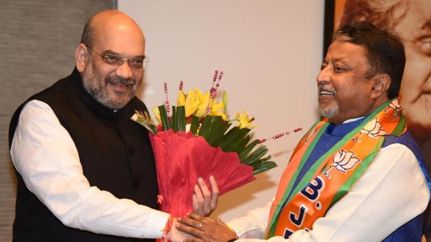 Former Trinamool Congress leader  Mukul Roy with BJP national president Amit Shah. (HT File Photo)