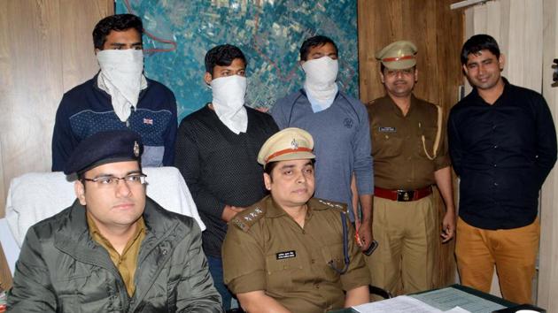 The arrested men in police custody. (Umesh Joshi/HT photo) The arrested men in police custody. (Umesh Joshi/HT photo)
