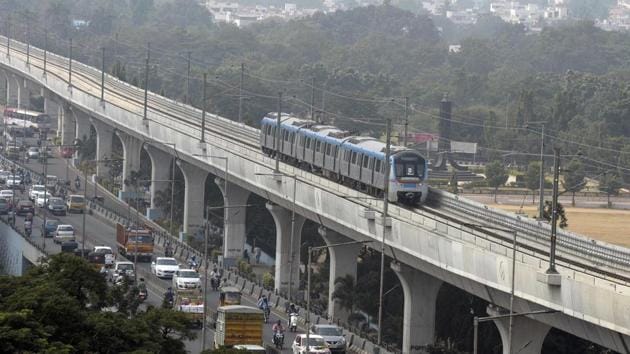 A metro train runs on an elevated railway line during a trial run undertaken ahead of the opening of the Hyderabad Metro Rail (HMR) project in Hyderabad. In its first phase with 24 stations, the metro will cover a 30 km stretch and is expected to carry 17 lakh passengers everyday. (Noah Seelam / AFP)