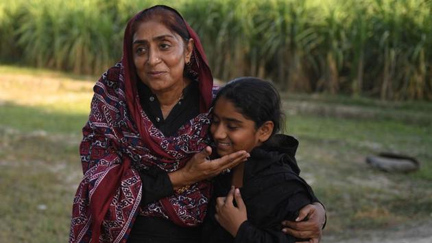 Mukhtiar Naz (L), known as Waderi Nazo Dharejo with her daughter Urooj in Qazi Ahmed, Pakistan. A fierce gunfight earned her the moniker of ‘Pakistan’s toughest woman’, and became the subject of the film ‘My Pure Land’ which has been entered in next year’s Academy Awards, vying for glory alongside heavy-hitters such as Angelina Jolie’s “First They Killed My Father” and Joachim Trier’s “Thelma”. (Asif Hassan / AFP) Mukhtiar Naz (L), known as Waderi Nazo Dharejo with her daughter Urooj in Qazi Ahmed, Pakistan. A fierce gunfight earned her the moniker of ‘Pakistan’s toughest woman’, and became the subject of the film ‘My Pure Land’ which has been entered in next year’s Academy Awards, vying for glory alongside heavy-hitters such as Angelina Jolie’s “First They Killed My Father” and Joachim Trier’s “Thelma”. (Asif Hassan / AFP)