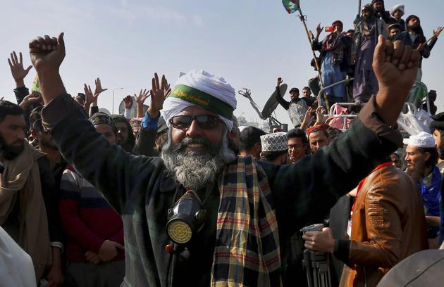 Tehreek-e-Labbaik supporters celebrate after Pakistan’s law minister Zahid Hamid resigned. (AP) Tehreek-e-Labbaik supporters celebrate after Pakistan’s law minister Zahid Hamid resigned. (AP)