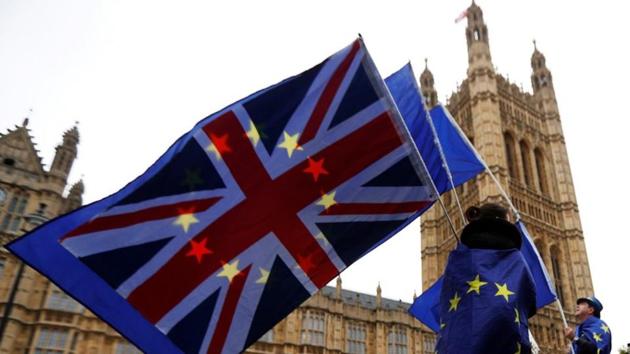 Anti-Brexit protesters wave EU and Union flags outside the Houses of Parliament in London, Britain. (Reuters File Photo) Anti-Brexit protesters wave EU and Union flags outside the Houses of Parliament in London, Britain. (Reuters File Photo)