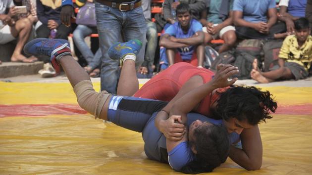 Freedom Yadav slams her opponent Bhavana to the mat during their match. A total of 24 young women are participating in two weight classes of 48kg and 75kg at the event. (Rajesh Kumar / HT Photo) Freedom Yadav slams her opponent Bhavana to the mat during their match. A total of 24 young women are participating in two weight classes of 48kg and 75kg at the event. (Rajesh Kumar / HT Photo)