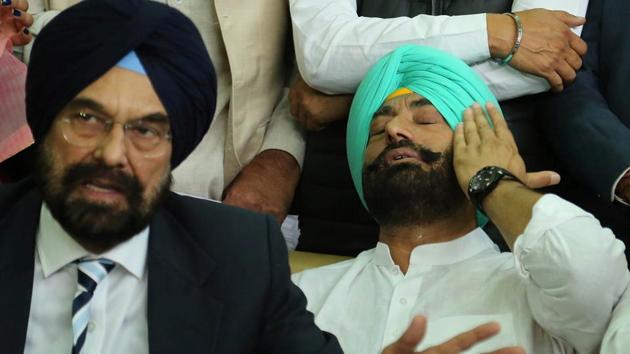 AAP MLA Kanwar Sandhu makes a point as leader of opposition Sukhpal Khaira wipes his tears after an emotional outburst at a press conference in Chandigarh on Wednesday. (HT Photo) AAP MLA Kanwar Sandhu makes a point as leader of opposition Sukhpal Khaira wipes his tears after an emotional outburst at a press conference in Chandigarh on Wednesday. (HT Photo)
