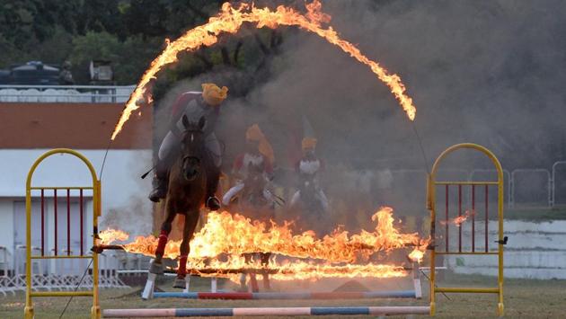 Cadets display their horse riding skills during the PT & Equestrian Display of the 133rd NDA course at The National Defence Academy (NDA) in Pune on Wednesday. (Pratham Gokhale/HT Photo) 