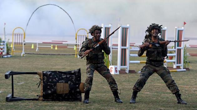 Cadets enact a combat scene as they prepare for the bayonet charge (dhava) during the PT & Equestrian Display of the 133rd NDA course at The National Defence Academy (NDA) in Pune on Wednesday. (Pratham Gokhale/HT Photo) 