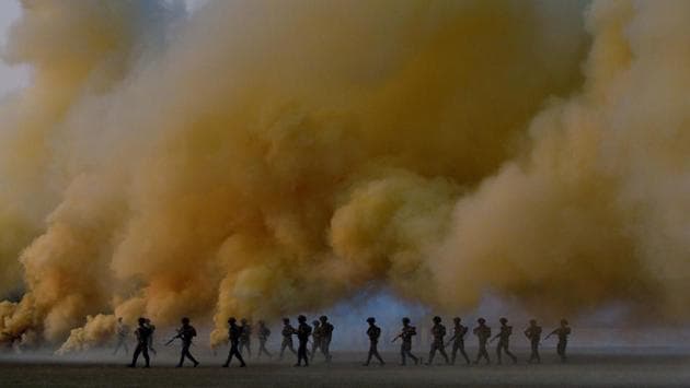 Cadets enact a combat scene as they prepare for the bayonet charge (dhava) during the PT & Equestrian Display of the 133rd NDA course at The National Defence Academy (NDA) in Pune on Wednesday. (Pratham Gokhale/HT Photo) 