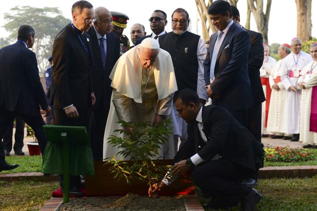 Pope Francis plants a tree during his visit to Bangladesh’s National Martyrs' Memorial in Savar, some 30 km from Dhaka on November 30, 2017. (AFP) Pope Francis plants a tree during his visit to Bangladesh’s National Martyrs' Memorial in Savar, some 30 km from Dhaka on November 30, 2017. (AFP)
