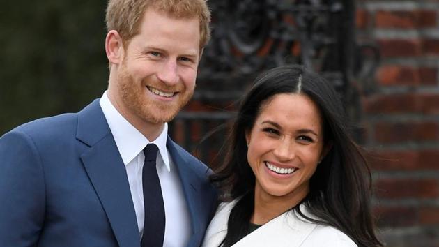 Britain's Prince Harry poses with Meghan Markle in the Sunken Garden of Kensington Palace. (REUTERS) Britain's Prince Harry poses with Meghan Markle in the Sunken Garden of Kensington Palace. (REUTERS)