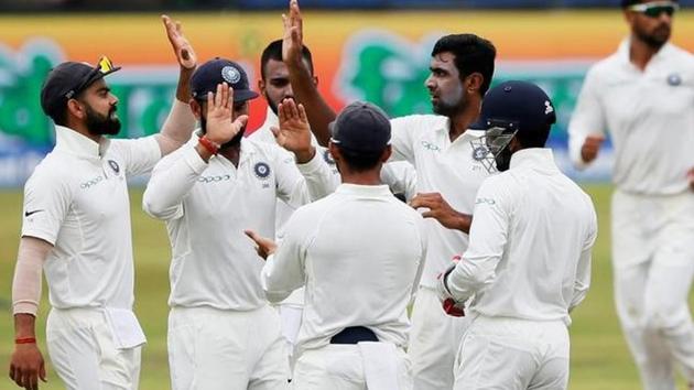 Indian cricket team’s Ravichandran Ashwin celebrates with captain Virat Kohli , Cheteshwar Pujara and his teammates after taking the wicket of Sri Lanka's Dimuth Karunaratne (not pictured) during the second Test against Sri Lanka cricket team in Nagpur -- the match in which he became the fastest bowler to get to 300 wickets. (Reuters) Indian cricket team’s Ravichandran Ashwin celebrates with captain Virat Kohli , Cheteshwar Pujara and his teammates after taking the wicket of Sri Lanka's Dimuth Karunaratne (not pictured) during the second Test against Sri Lanka cricket team in Nagpur -- the match in which he became the fastest bowler to get to 300 wickets. (Reuters)