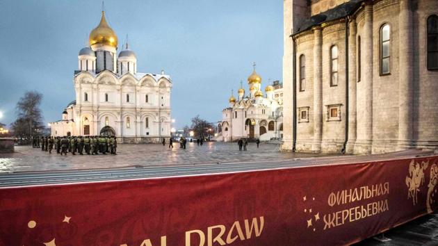 Servicemen practice at the Kremlin in Moscow on the eve of the Final Draw for the 2018 FIFA World Cup.  (AFP) 