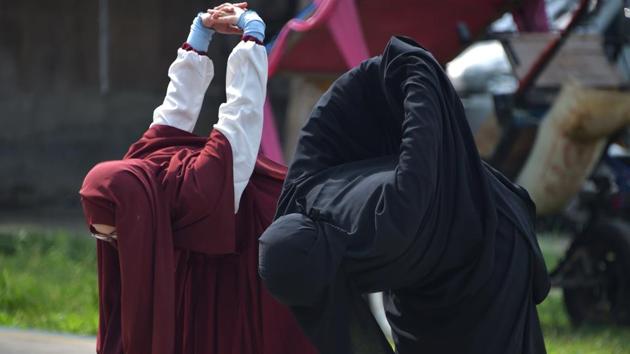 Members of the squad stretches prior taking archery lessons in Bekasi. Seeking out other women facing discrimination online, Indadari Mindrayanti founded the squad this year after switching from hijab --a headscarf that leaves the face visible-- to the more restrictive niqab in 2016. (Adek Berry / AFP) Members of the squad stretches prior taking archery lessons in Bekasi. Seeking out other women facing discrimination online, Indadari Mindrayanti founded the squad this year after switching from hijab --a headscarf that leaves the face visible-- to the more restrictive niqab in 2016. (Adek Berry / AFP)