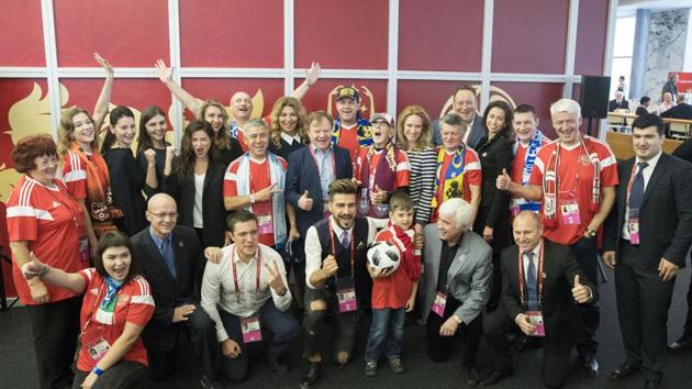 Host City Ambassadors and superfans pose for a group picture in the State Kremlin Palace in Moscow.  (AP) 