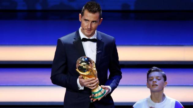 Miroslav Klose with the FIFA World Cup trophy during the draw. (REUTERS) Miroslav Klose with the FIFA World Cup trophy during the draw. (REUTERS)