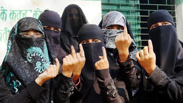 Burqa-clad voters after casting their votes for municipal elections in Varanasi on Sunday.(PTI File Photo)