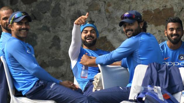 IVirat Kohli, Indian cricket team skipper shares a light moment during a practice session ahead of the third Test match between India and Sri Lanka in New Delhi. (AFP)
