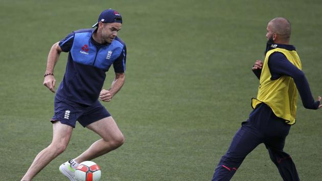 James Anderson has a football session with Moeen Ali under lights in Adelaide. (AP)