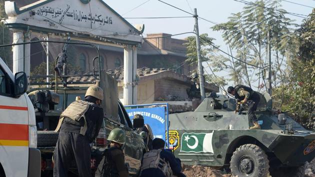 Pakistani security personnel take position outside an Agriculture Training Institute after an attack by Taliban militants in Peshawar on December 1. (AFP Photo) Pakistani security personnel take position outside an Agriculture Training Institute after an attack by Taliban militants in Peshawar on December 1. (AFP Photo)