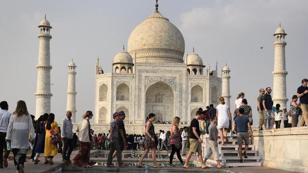 Tourists visiting Taj Mahal in Agra on October 11.(Burhaan Kinu/HT PHOTO)