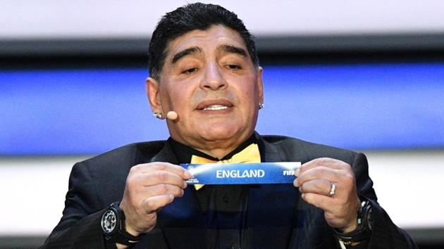 Former Argentina legend Diego Maradona displays the slip of England during the Final Draw for the 2018 FIFA World Cup at the State Kremlin Palace in Moscow on Friday. (AFP) Former Argentina legend Diego Maradona displays the slip of England during the Final Draw for the 2018 FIFA World Cup at the State Kremlin Palace in Moscow on Friday. (AFP)