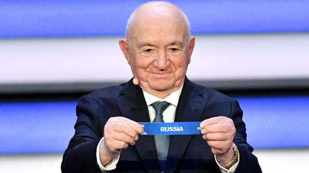 Former USSR forward and coach Nikita Simonyan displays the slip of Russia during the Final Draw for the 2018 FIFA World Cup at the State Kremlin Palace in Moscow on Friday. (AFP) Former USSR forward and coach Nikita Simonyan displays the slip of Russia during the Final Draw for the 2018 FIFA World Cup at the State Kremlin Palace in Moscow on Friday. (AFP)