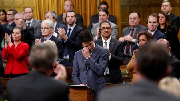 Canada's Prime Minister Justin Trudeau wipes away tears while delivering an apology to members of the LGBT community who were discriminated against by federal legislation and policies fro decades, in the House of Commons on Parliament Hill on November 28, 2017 in Ottawa, Canada. (Chris Wattie / REUTERS)
