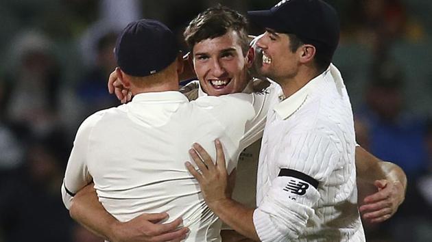 England cricket team's Craig Overton (centre) celebrates with teammates Jonny Bairstow (left) and Alastair Cook after bowling out Australia cricket team skipper Steve Smith during their Ashes 2017-18 second Test in Adelaide on Saturday. (AP) England cricket team's Craig Overton (centre) celebrates with teammates Jonny Bairstow (left) and Alastair Cook after bowling out Australia cricket team skipper Steve Smith during their Ashes 2017-18 second Test in Adelaide on Saturday. (AP)
