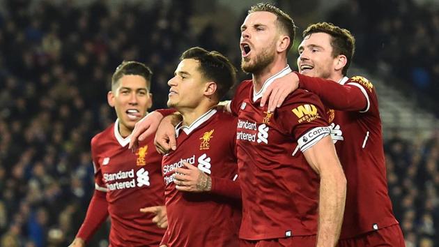 Liverpool footballers celebrate after their win over Brighton and Hove Albion in the Premier League. (AFP) Liverpool footballers celebrate after their win over Brighton and Hove Albion in the Premier League. (AFP)