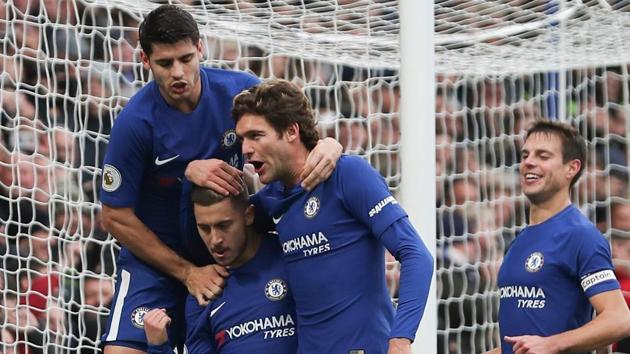 Chelsea FC midfielder Eden Hazard (2nd left) celebrates with teammates after scoring the team's third goal, and his second of the match, against Newcastle United in their Premier League match at Stamford Bridge in London on Saturday. (AFP) Chelsea FC midfielder Eden Hazard (2nd left) celebrates with teammates after scoring the team's third goal, and his second of the match, against Newcastle United in their Premier League match at Stamford Bridge in London on Saturday. (AFP)