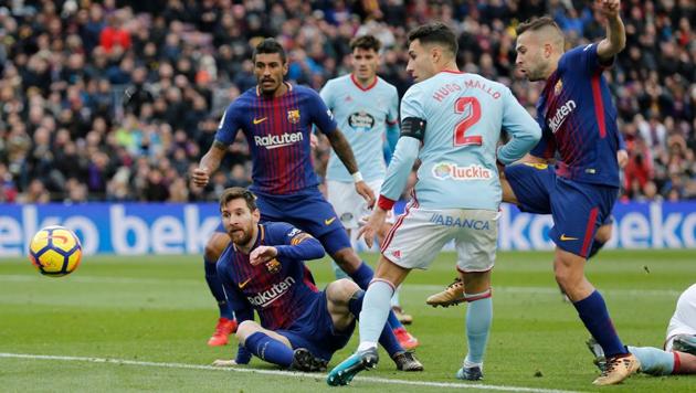 Barcelona's Lionel Messi looks at the ball shot by Barcelona's Spanish defender Jordi Alba (R) during the match between FC Barcelona vs RC Celta at the Camp Nou stadium in Barcelona. (AFP) Barcelona's Lionel Messi looks at the ball shot by Barcelona's Spanish defender Jordi Alba (R) during the match between FC Barcelona vs RC Celta at the Camp Nou stadium in Barcelona. (AFP)