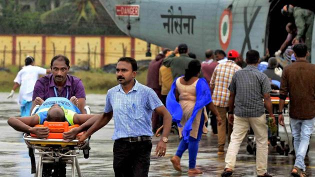 A fisherman is taken to a hospital in Thiruvananthapuram on Friday, after being rescued by defence personnel from rough seas. While 37 rescued fishermen are being treated at the Medical College hospital, another 34 are under medical observation at the General hospital. (PTI) 