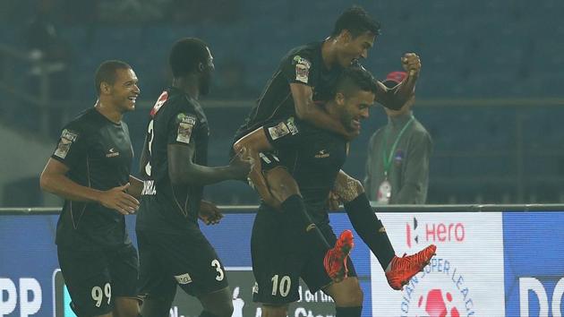 Marcinho (Marcio de Souza) of Northeast United FC celebrates with teammates after scoring for NorthEast United FC in their Indian Super League (ISL) match against Delhi Dynamos FC at the Jawaharlal Nehru Stadium in New Delhi on Saturday. Get highlights of Delhi Dynamos vs NorthEast United FC here. (ISL / SPORTZPICS)