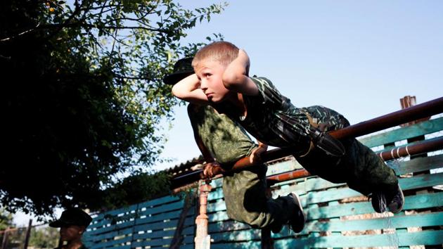 Members of the pro-military club "Patriot" from the Crimean city of Evpatoria, train during a visit to the base of the "Russian Knights" club, in the village of Sengileyevskoye, in Stavropol region. Most cadets come from families of active Russian soldiers or officers from other security forces. (Eduard Korniyenko / REUTERS) Members of the pro-military club "Patriot" from the Crimean city of Evpatoria, train during a visit to the base of the "Russian Knights" club, in the village of Sengileyevskoye, in Stavropol region. Most cadets come from families of active Russian soldiers or officers from other security forces. (Eduard Korniyenko / REUTERS)