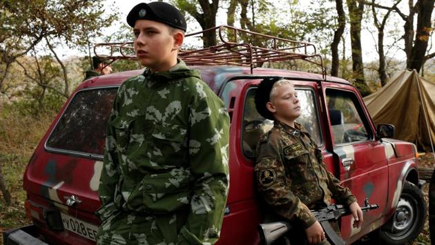 Students from the General Yermolov Cadet School take a break during a tactical exercise on the ground, which includes intrenchment training, forest survival studies and other activities, outside Stavropol. About 40 percent of school attendees here end up joining the military or law enforcement agencies. (Eduard Korniyenko / REUTERS) Students from the General Yermolov Cadet School take a break during a tactical exercise on the ground, which includes intrenchment training, forest survival studies and other activities, outside Stavropol. About 40 percent of school attendees here end up joining the military or law enforcement agencies. (Eduard Korniyenko / REUTERS)